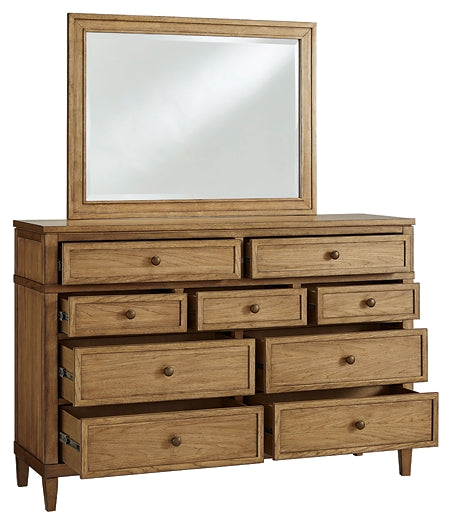 Sharlance California King Upholstered Panel Bed with Mirrored Dresser and Nightstand